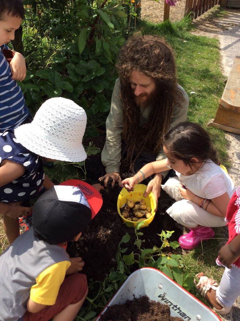 Collecting our potatoes with Dan our gardener. We love you Dan for all the special things you have taught us.