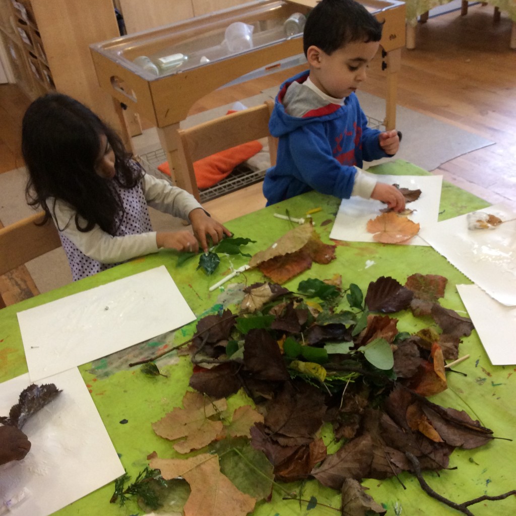 Discussing our nature walk collection and working on art pieces to take home.